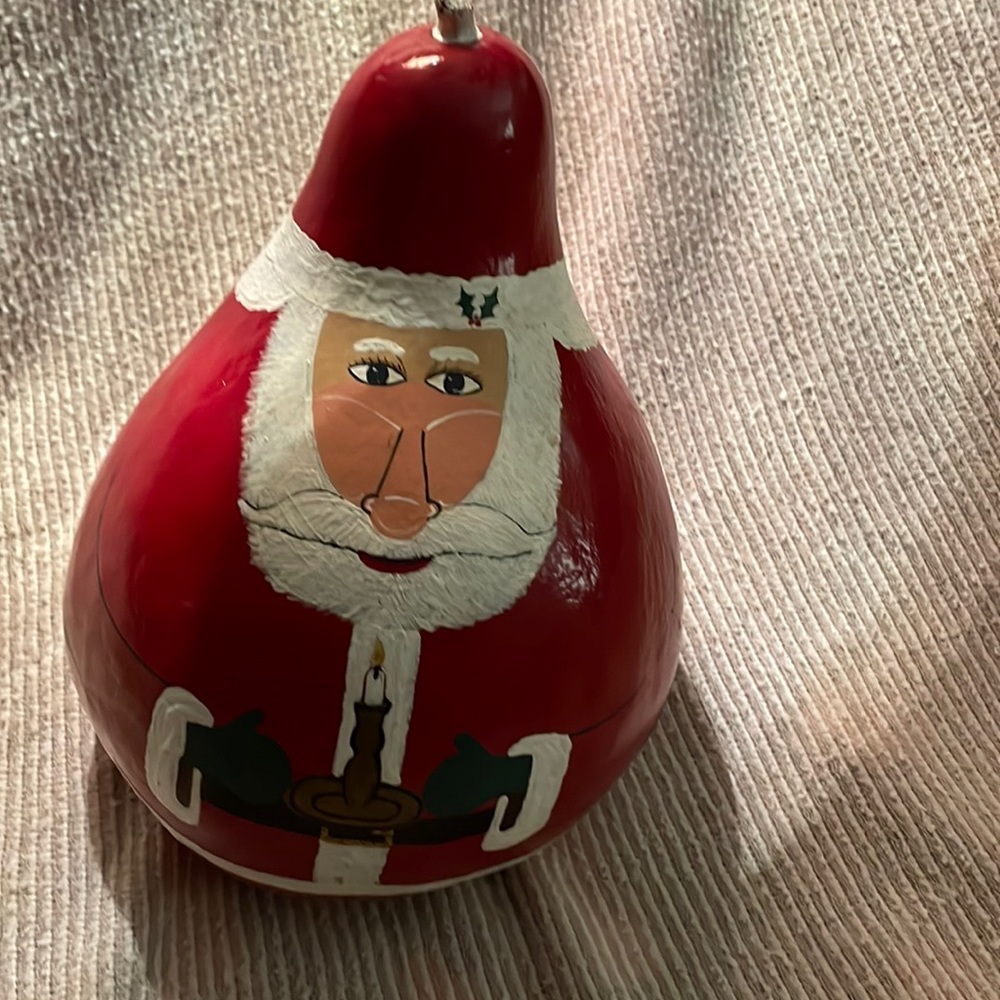 Hand painted Gourd. Painted to be Santa Clause. 23” around and 10” tall. 🎅